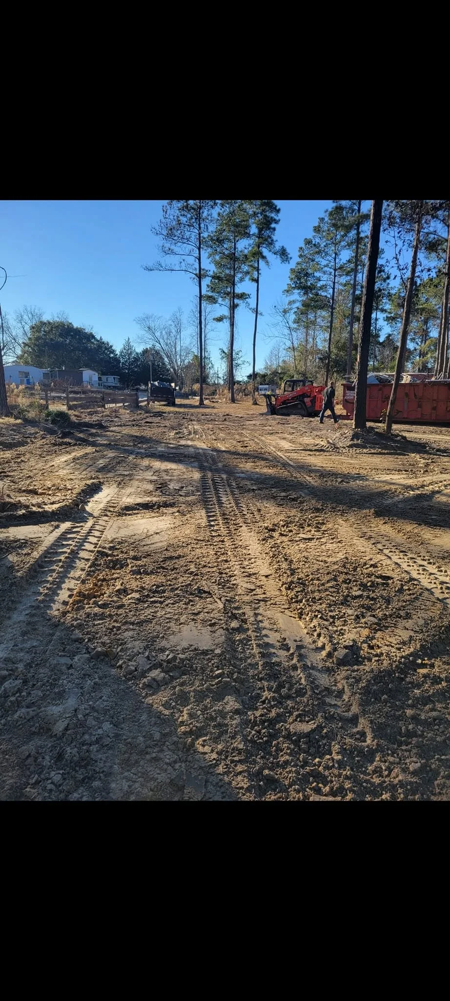 Cleared dirt lot after junk and debris removal